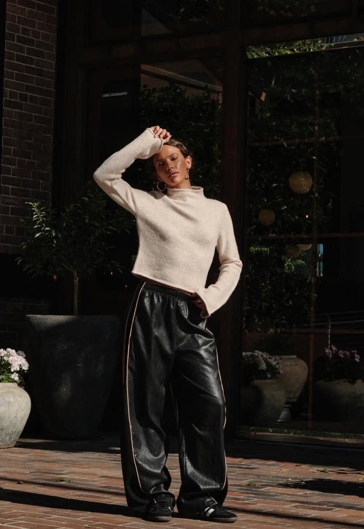 Solid Knit Mock-Neck Bell-Sleeve
Rolled-Edge Crop Sweater