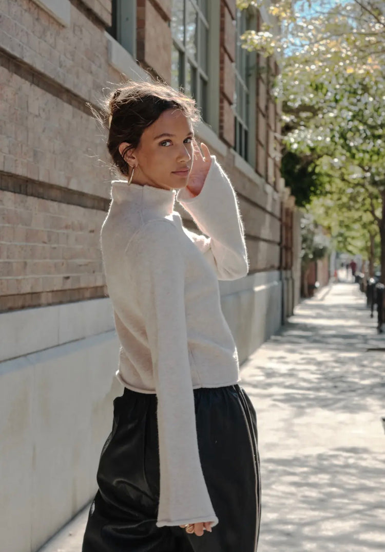 Solid Knit Mock-Neck Bell-Sleeve
Rolled-Edge Crop Sweater